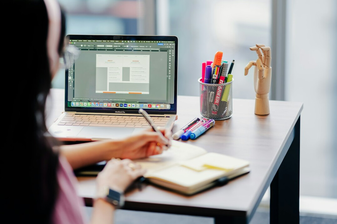 graphic designer at desk with computer