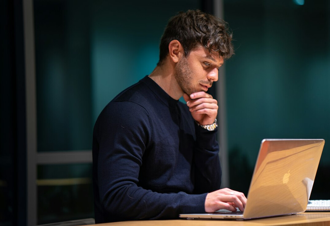 data analyst working on laptop