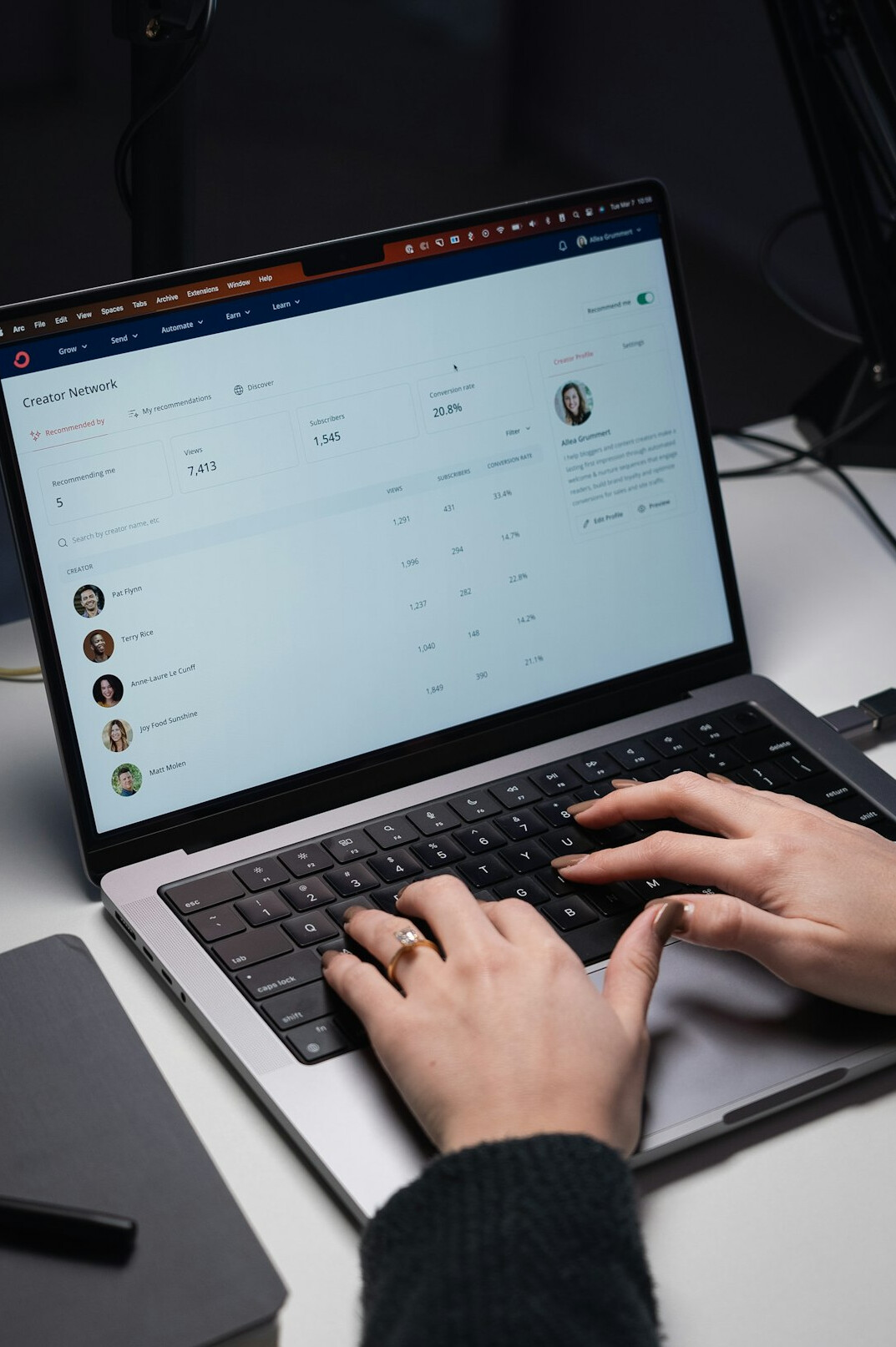 person creating social media post on laptop