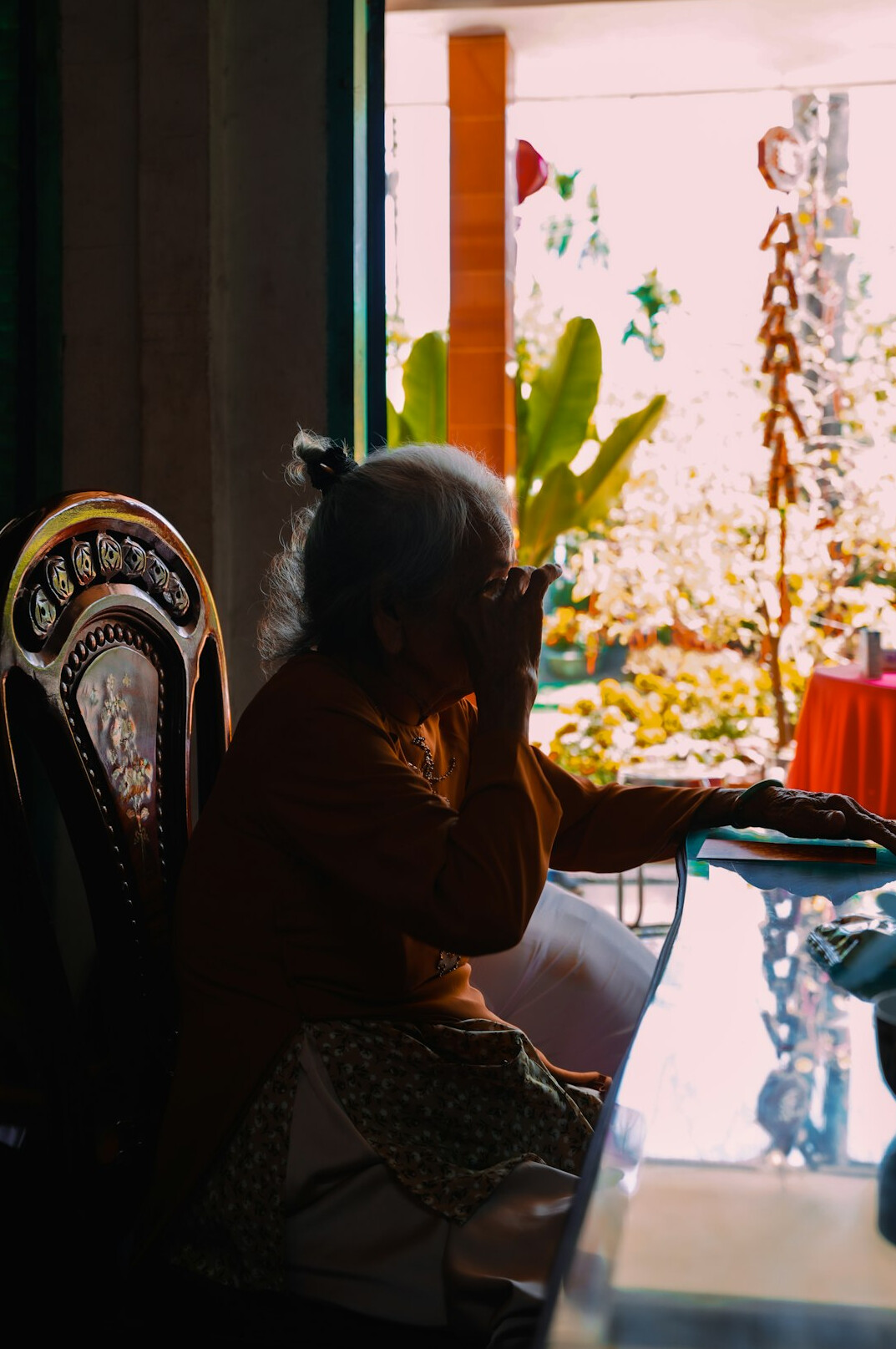 Senior woman wearing headphones on a laptop video call
